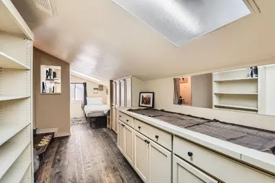 a kitchen with white cabinets and a ceiling at Heron Pond in Broomfield