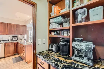 a kitchen with a coffee maker on a counter at Heron Pond in Broomfield