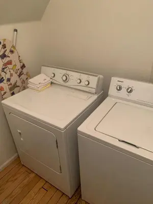 a white washer and dryer in a room at Charming Family Home with Cozy Retreat in Denver