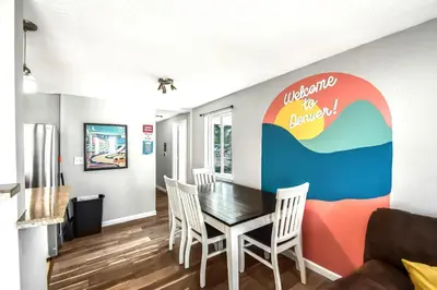a dining room with a table and chairs at Dog Friendly and Family Sized Home in Denver Perfect for Your Furry Friend in Denver