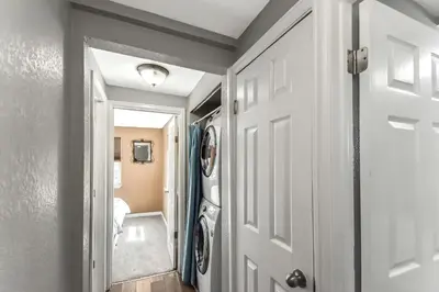 a hallway with a door leading to a bathroom at Dog Friendly and Family Sized Home in Denver Perfect for Your Furry Friend in Denver
