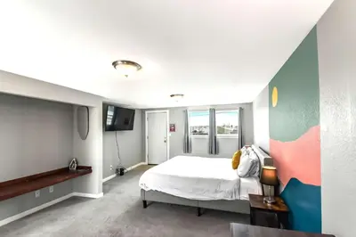 a bedroom with a large bed and a tv at Dog Friendly and Family Sized Home in Denver Perfect for Your Furry Friend in Denver
