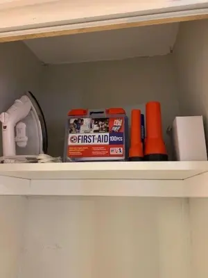 a shelf with first aid items on it at Southwest Charm Spacious Family Home Near Denver in Denver