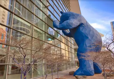 a large blue bear statue in front of a building at Spacious Arvada Family Home with King Beds and Office in Arvada