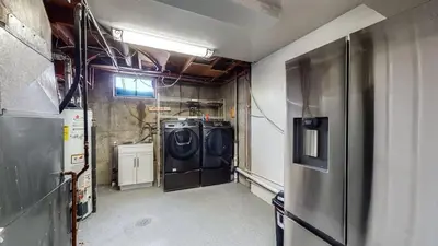 a garage with a washer and dryer in it at Cozy Lower Unit Retreat in Denver in Denver
