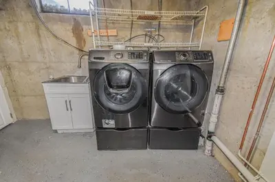 a washer and a washing machine in a garage at Cozy Lower Unit Retreat in Denver in Denver