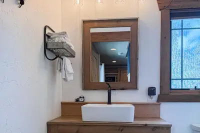 a bathroom with a sink and a mirror at Shadow Mountain Marina in Grand Lake
