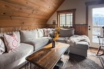 a living room with a couch and a table at Shadow Mountain Marina in Grand Lake
