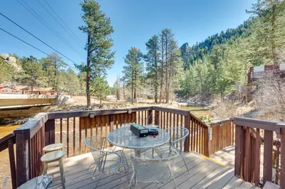 a patio with a table and chairs on a deck at Private Hot Tub and Deck Riverfront Escape in Drake in Drake