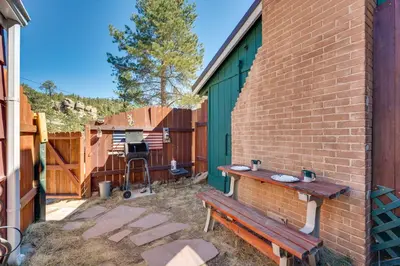 a patio with a bench and a fence at Private Hot Tub and Deck Romantic Getaway in Drake in Drake
