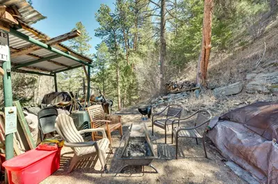 a group of chairs and a table on a patio at Private Hot Tub and Deck Romantic Getaway in Drake in Drake