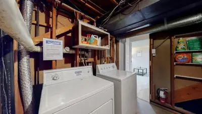 a laundry room with a washer and dryer at Cozy Mountain-Inspired Lower Unit in Denver in Denver