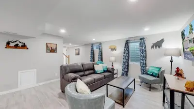 a living room with a couch and a table at Modern & Updated Unit in Prime Location in Denver