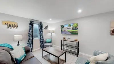 a living room with a couch and a table at Modern & Updated Unit in Prime Location in Denver