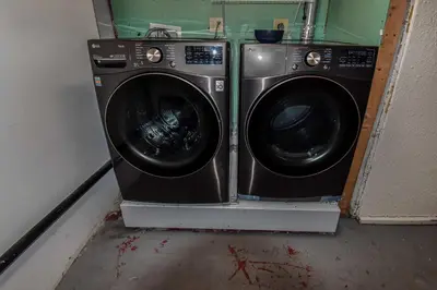 a washing machine and a dryer in a room at Enchanting Upper Unit with City Charm in Denver