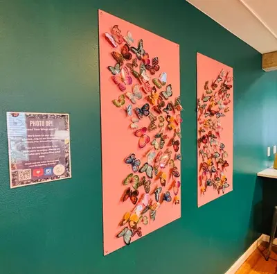 a wall with two pictures of superheroes on it at Enchanting Upper Unit with City Charm in Denver