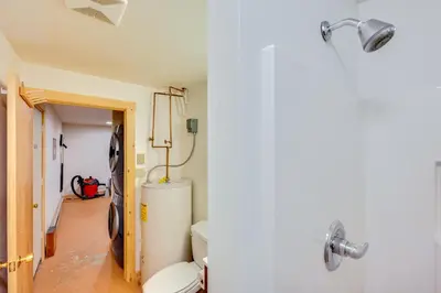 a bathroom with a toilet and a sink at 4 Mi to RMNP Allenspark Cabin with Wraparound Deck! in Allenspark