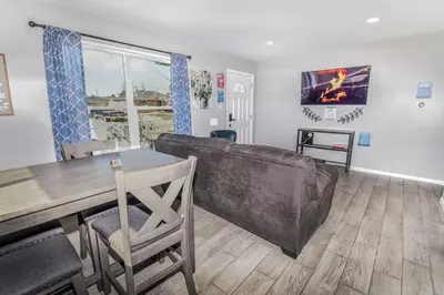 a living room with a couch and a table at Awesome Two Bedroom Family Upper Unit in Denver in Denver