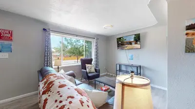 a living room with a couch and a window at Arvada Private Family Home with Two King Beds in Arvada
