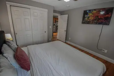 a bedroom with a bed and a painting on the wall at Cozy and Budget Friendly Single Bedroom in the Heart of Denver in Denver