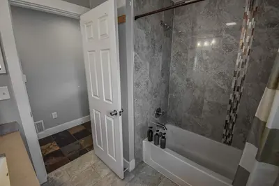 a bathroom with a shower with a glass door at Cozy and Budget Friendly Single Bedroom in the Heart of Denver in Denver