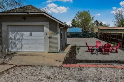 a garage with red chairs and a table next to it at Cozy and Budget Friendly Single Bedroom in the Heart of Denver in Denver