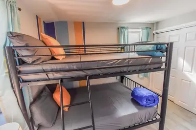 a bunk room with two bunk beds in it at Vibrant & Cozy Two Bedroom Lower Unit King Beds in Denver