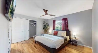 a bedroom with a bed and a ceiling fan at Updated Family Unit with Two King Beds in Denver
