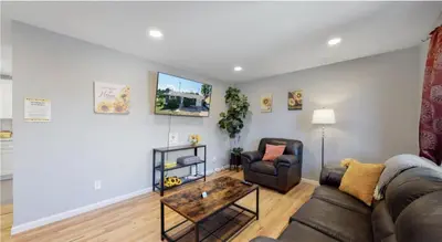 a living room with a couch and a table at Updated Family Unit with Two King Beds in Denver