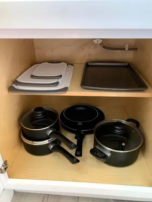 a drawer with pots and pans in a kitchen at Great Updated King Bed Near Denver Sports field and concerts in Commerce City