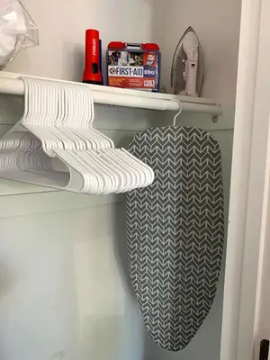 a closet with white and black towels on a shelf at Great Updated King Bed Near Denver Sports field and concerts in Commerce City
