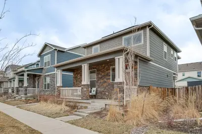 a house with blue siding at Perfect for Families! Quiet Aurora Home in Aurora