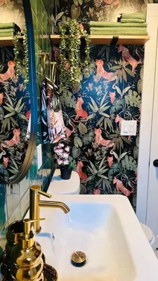 a bathroom with a sink and a floral wallpaper at NEW The Emerald Haus Near Regis and Denver in Denver