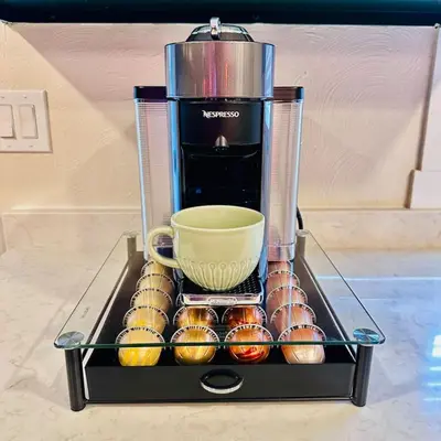 a coffee maker with a coffee cup and muffins at NEW The Emerald Haus Near Regis and Denver in Denver