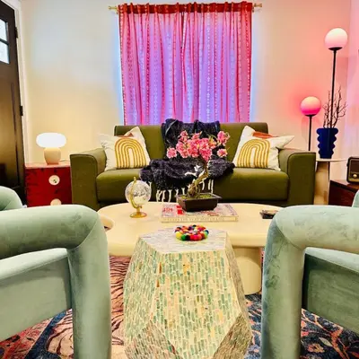 a living room with a couch and a table at NEW The Emerald Haus Near Regis and Denver in Denver