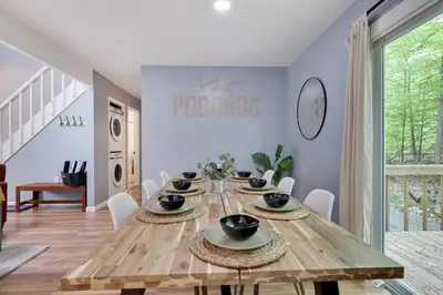 a dining room with a wooden table and chairs at Urban Oasis in the Heart of Denver with Hot tub in Denver
