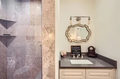 a bathroom with a sink and a mirror at With Pool Table Near to RiNo and City Park in Denver