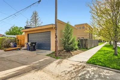 a house with a garage and a driveway at With Pool Table Near to RiNo and City Park in Denver