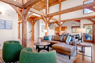 a living room with a couch and a table at Mountain Retreat Sleeps 10 with Pool Table and Arcade in Littleton