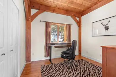 a home office with a desk and a chair at Mountain Retreat Sleeps 10 with Pool Table and Arcade in Littleton