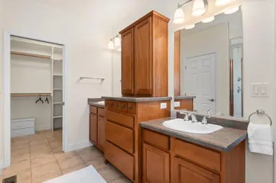 a bathroom with a sink and a mirror at Mountain Retreat Sleeps 10 with Pool Table and Arcade in Littleton