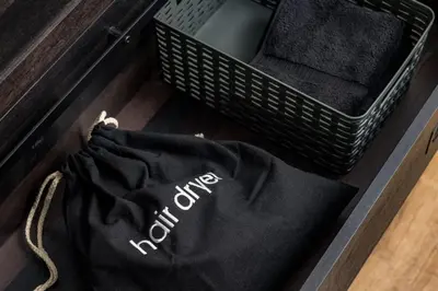 a black shirt sitting on the floor next to a basket at Spacious and Stylish Home with HotTub 12min to Downtown in Westminster