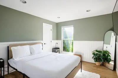 a bedroom with a white bed and a window at 5 Star Retreat With A Gym And APrivate Office in Thornton