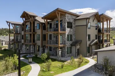 an architectural rendering of a large apartment building at Downtown Fraser with Hot Tub in Fraser
