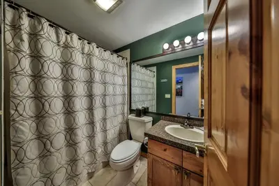a bathroom with a toilet and a sink at Rocky Mountain Retreat Steps to Slopes with Hot Tub and Spectacular Views in Winter Park