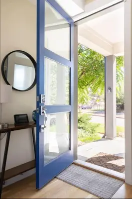 a blue door with a mirror and a table at New Build and Pet Friendly Near to Highlands and RiNo in Denver