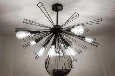 a metal chandelier hanging from a ceiling at 5 Bedroom Home 10 Min Drive To Downtown in Denver