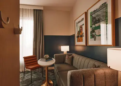 a living room with a couch and a table at Limelight Boulder in Boulder