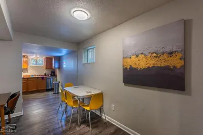 a kitchen and dining room with a table and chairs at Charming 2 Bed Start Your Denver Adventure in Denver