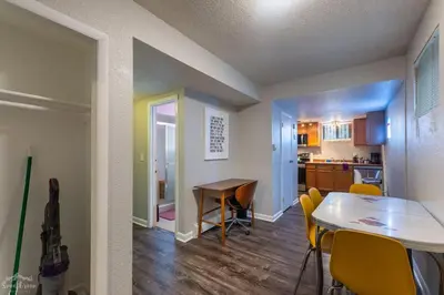 a dining room and kitchen with a table and chairs at Charming 2 Bed Start Your Denver Adventure in Denver
